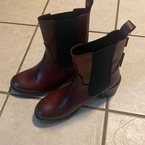 Made in Italy boots! Burgundy in color with heel. Never been worn!